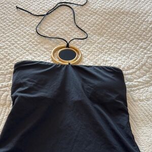 Black swimsuit with gold hardware detailing